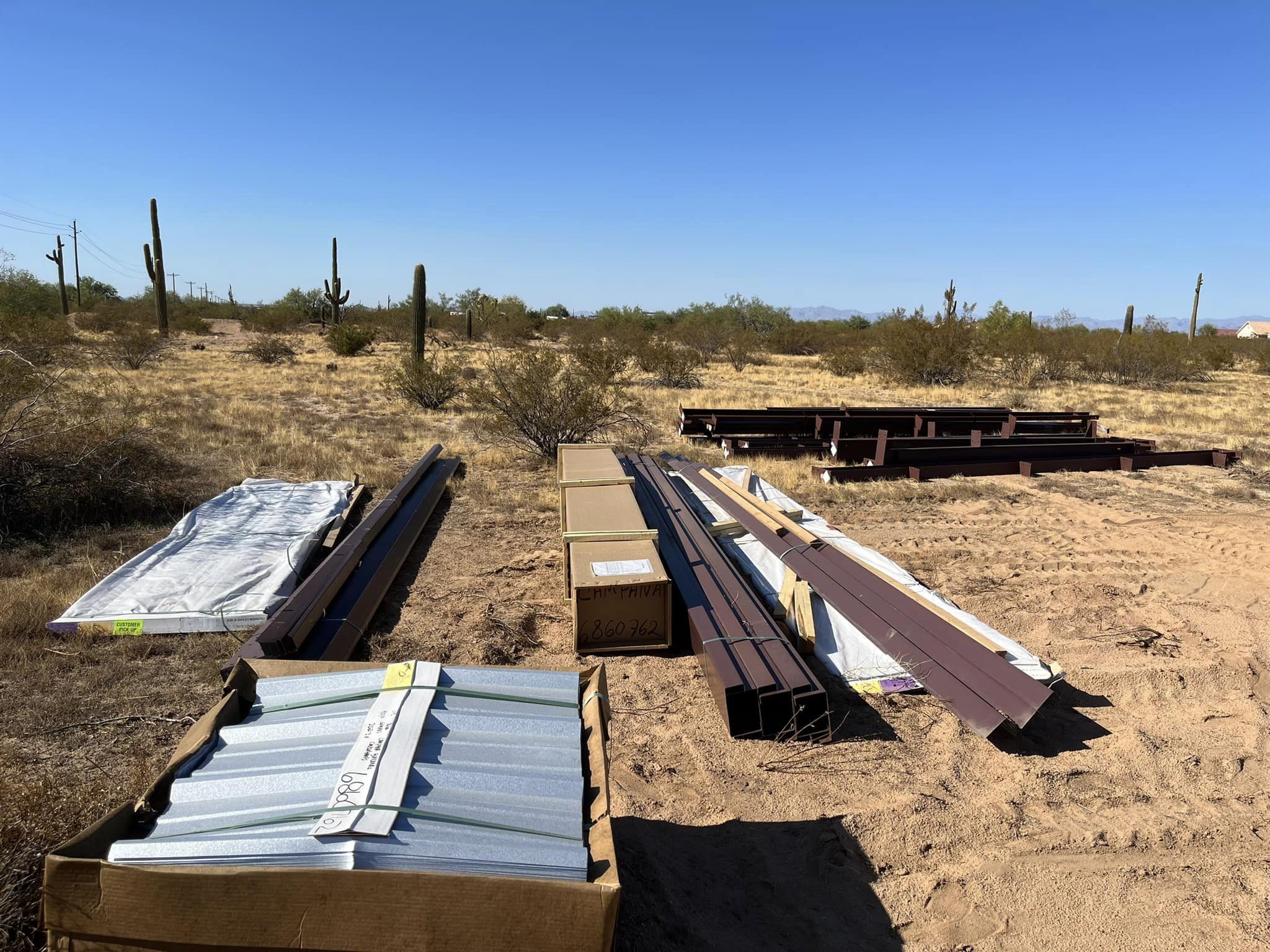A desert with many boxes and some metal bars