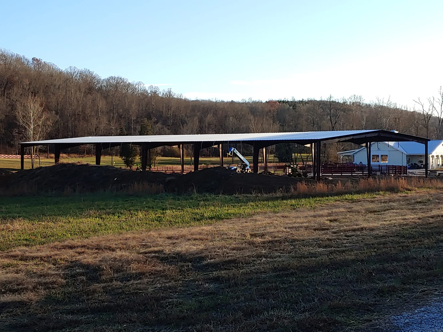 A large open field with a metal structure.