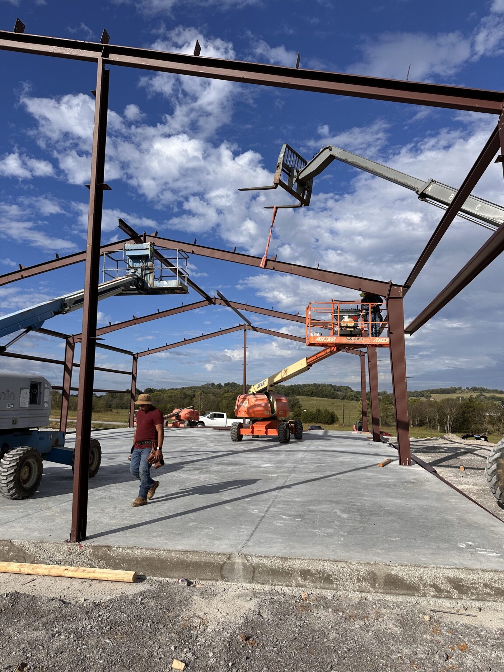 A man standing in front of a construction site.