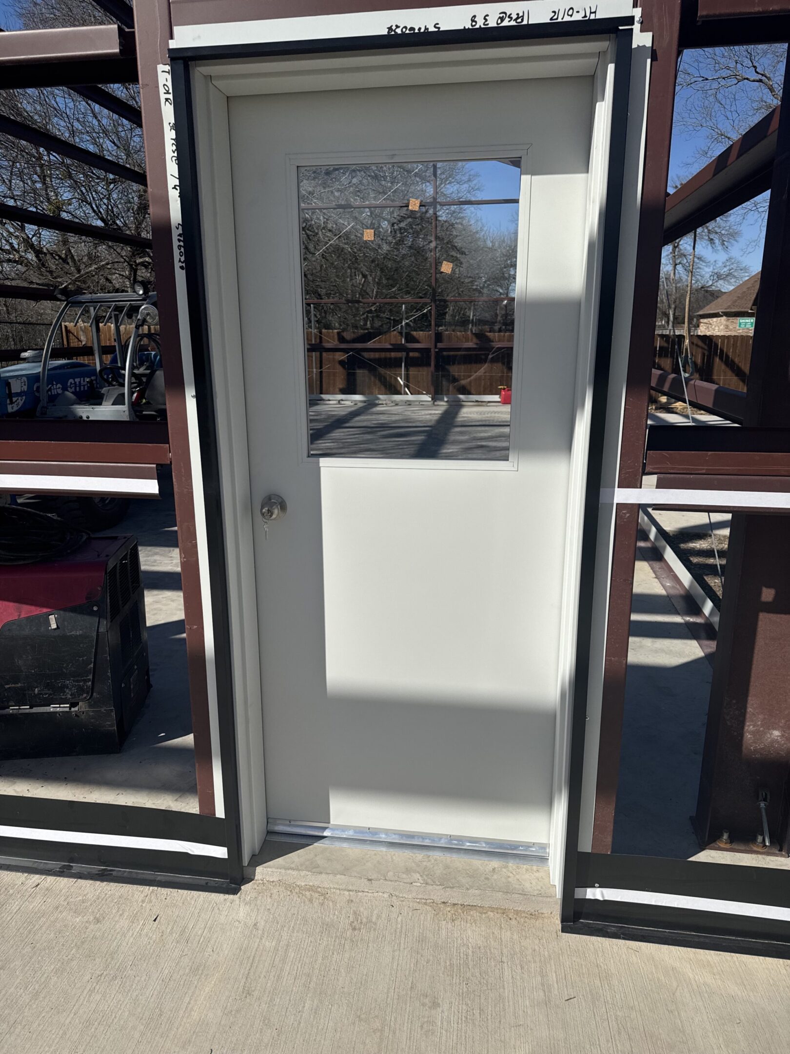 A door that is open and has some windows.