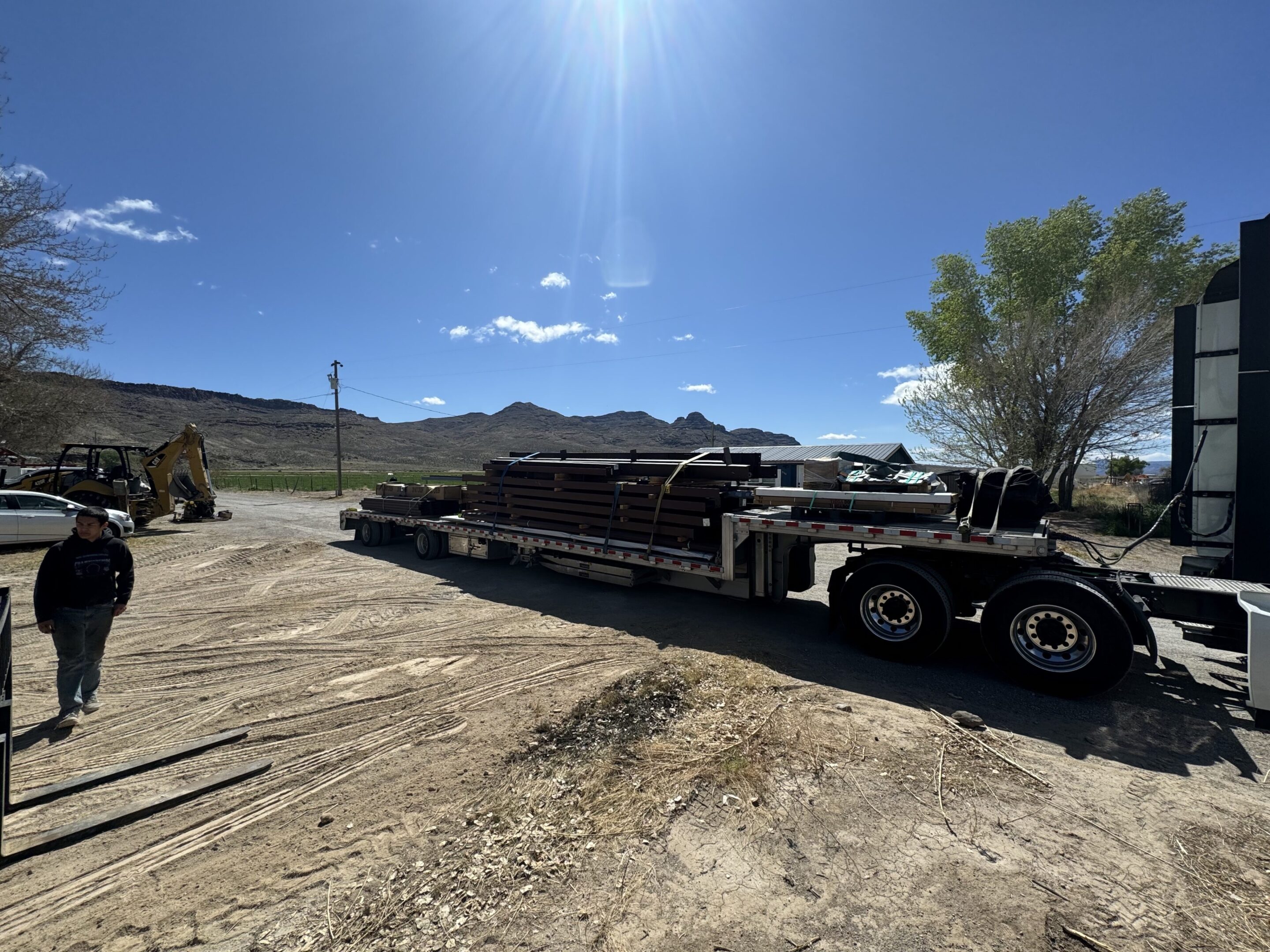 A large truck is parked on the side of a road.
