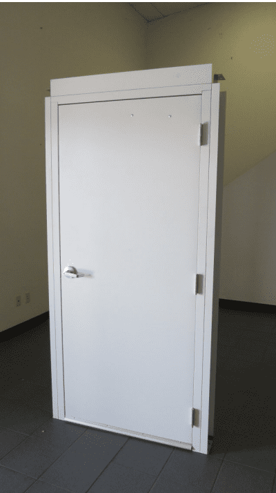 A white door in an empty room with no one inside.